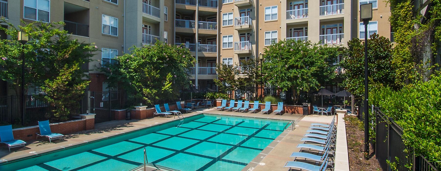 a swimming pool in front of a building